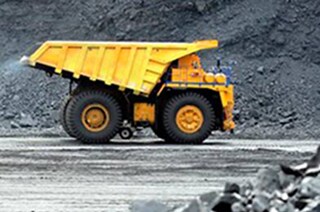 A truck carry load at coal mine