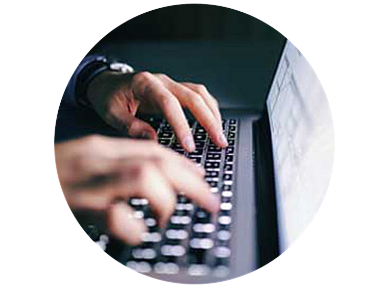 Close up of a person typing on a laptop's keyboard