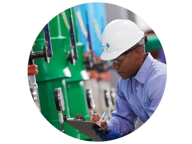 Technician inspecting compressors