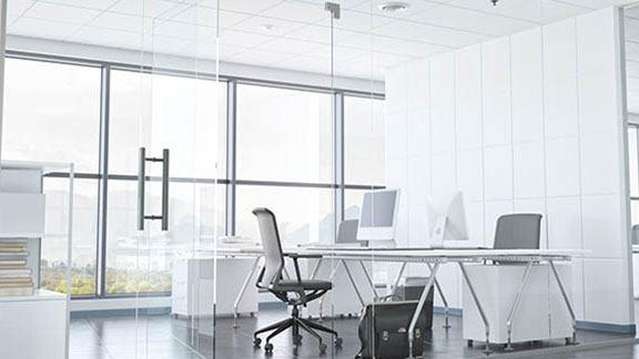 an office cubicle with a white table