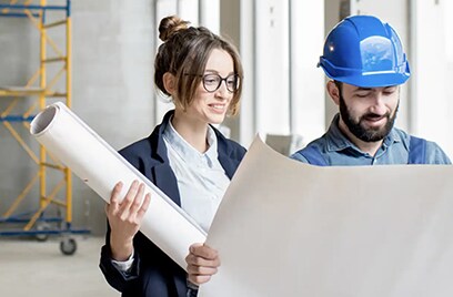 Foreman expertising the structure with businesswoman