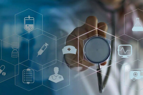 Doctor holding a stethoscope against a virtual screen displaying medical icons