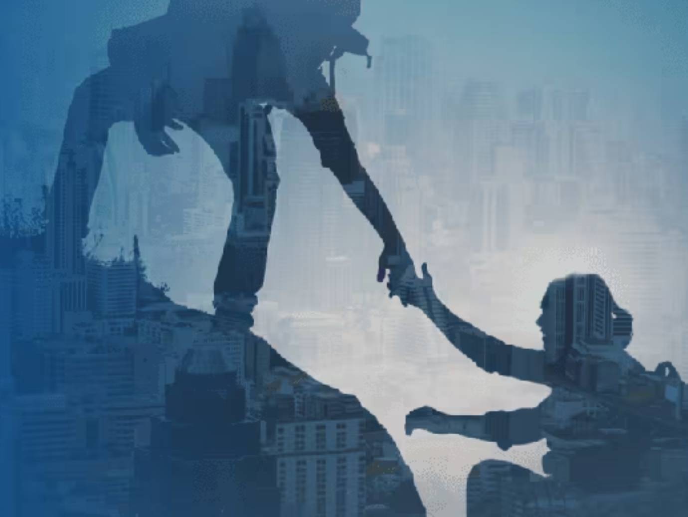 A hiker helping another climb uphill