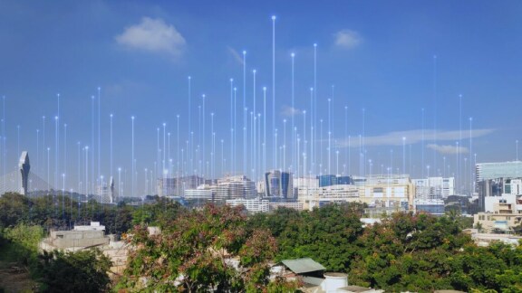 A city's skyline at daytime surrounded by greenery