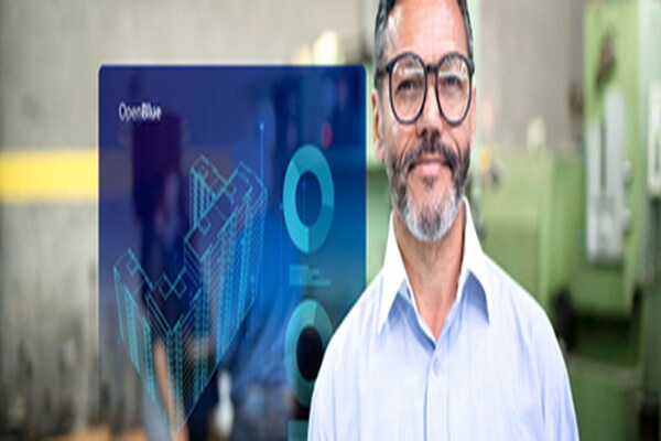 A male employee smiling at the camera with an overlaid image of OpenBlue Enterprise Manager window on the background