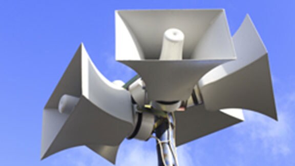 five megaphones attached to pole