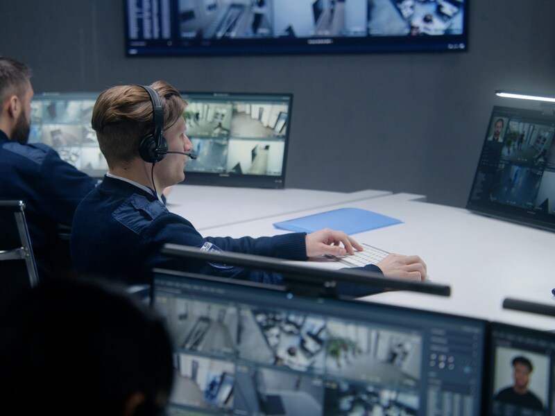 Security team members watching monitors